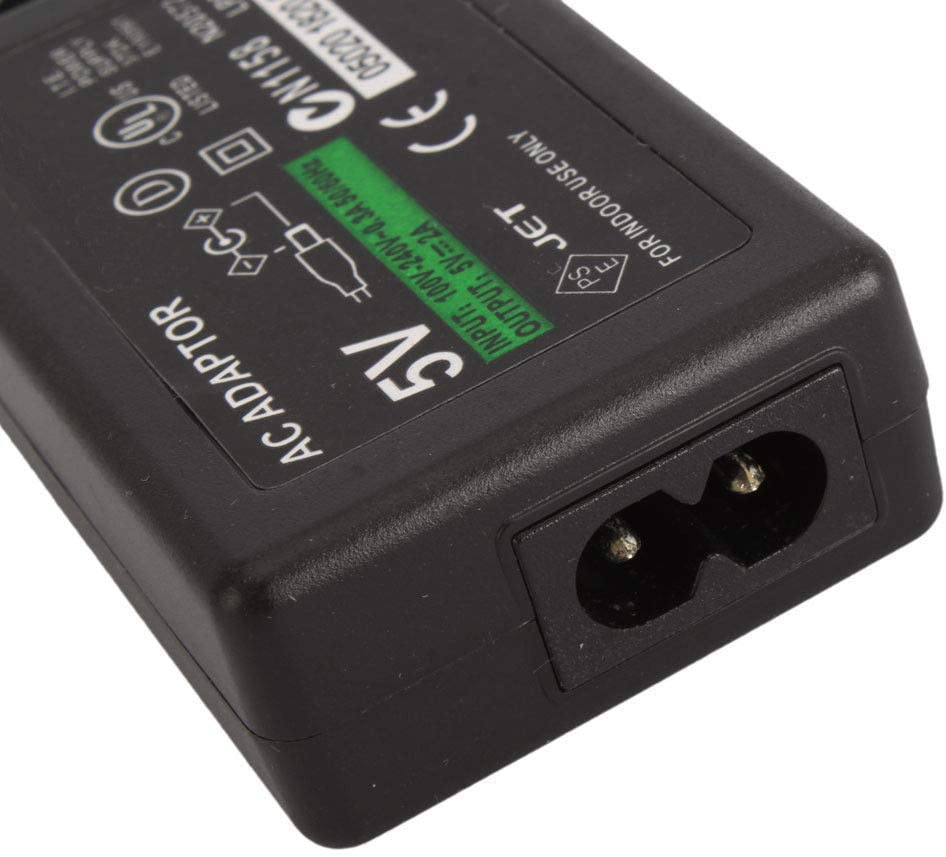 PSP charger plugged into a New Zealand power socket
