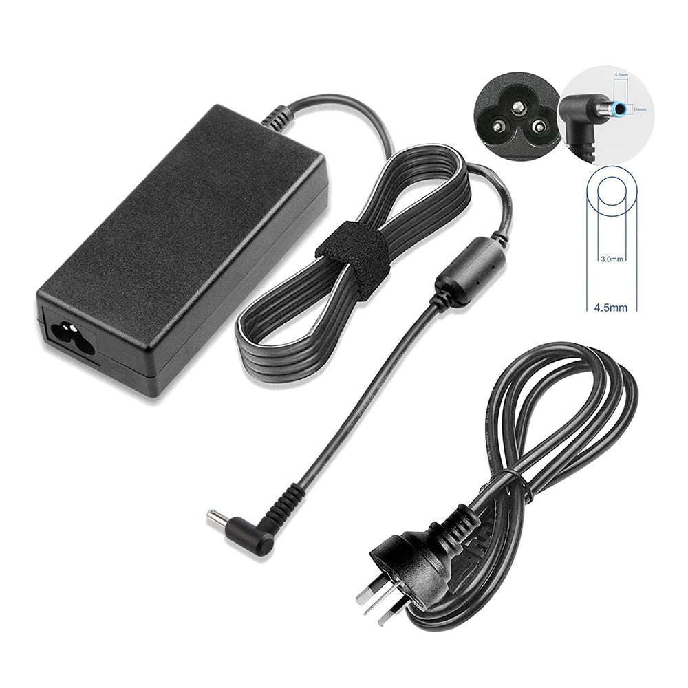 HP laptop charger 65W resting on a wooden desk surface