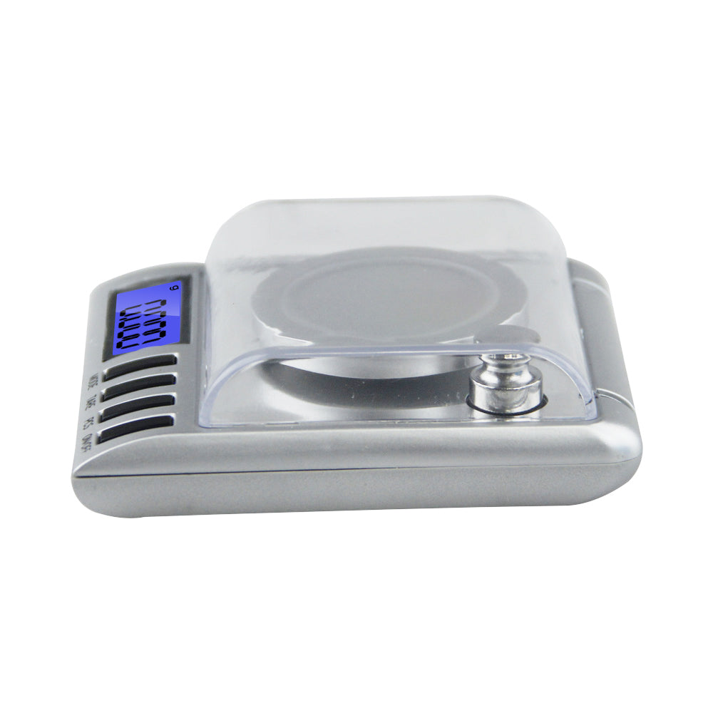 Digital scale 50g showing low battery and overload indicators
