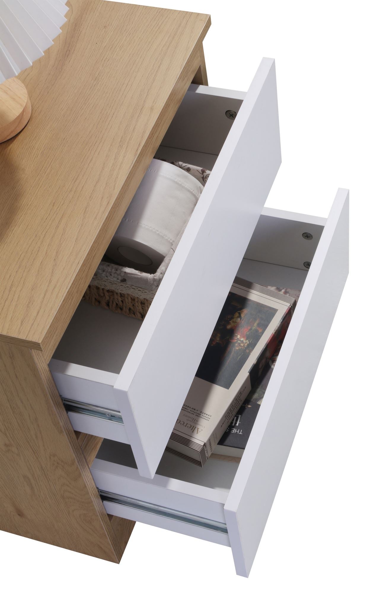 Bedside table drawer open with personal items inside