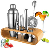 Cocktail shaker set with bamboo stand on wooden surface