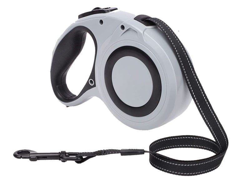 Grey retractable dog leash tape resting on wooden bench