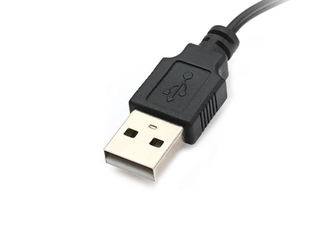 Plantronics Voyager Legend charger cable used with headset on desk