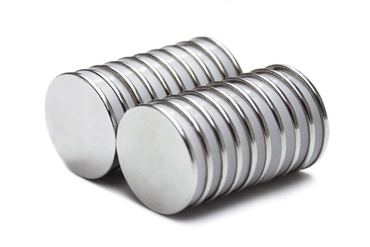 Neodymium magnets held in hand showing compact size