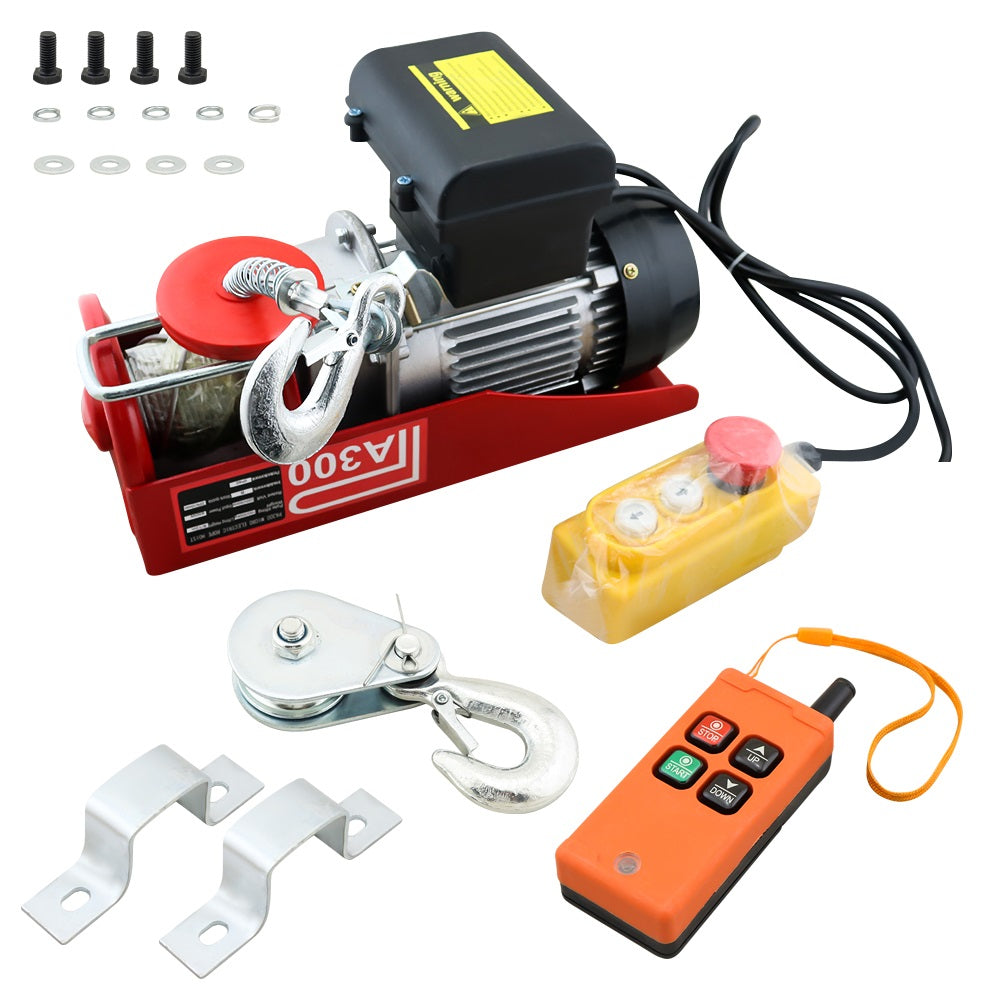 Wireless hoist winch lifting a small engine in a New Zealand garage