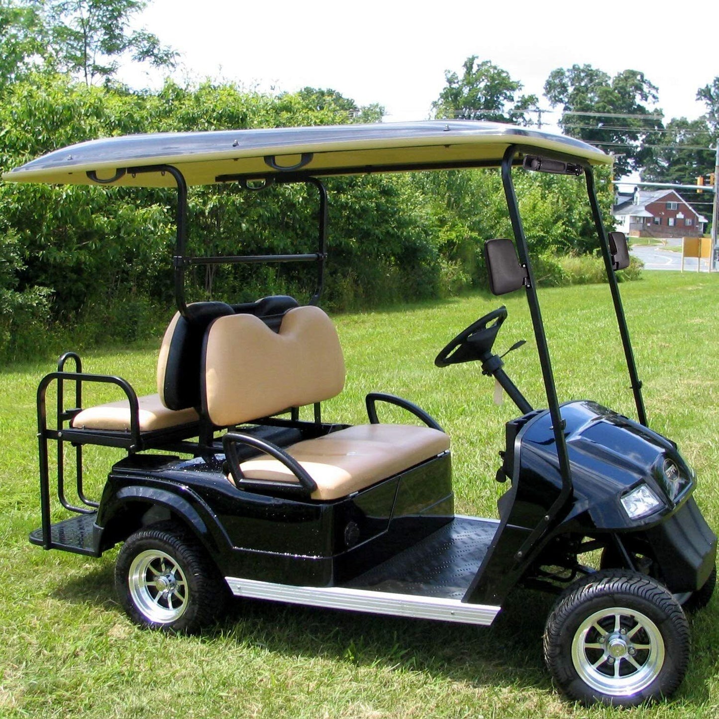 Golf cart side mirror showing clear reflective surface in daylight