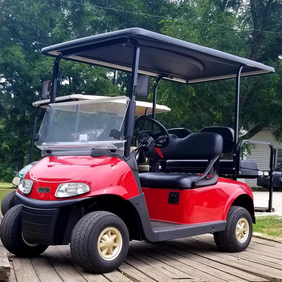 Golf cart side mirror showing mounting on hollow bar