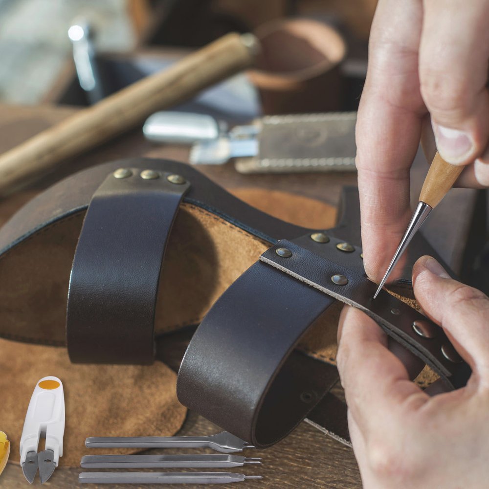 Leather craft kit showing edge beveler and scribing heads