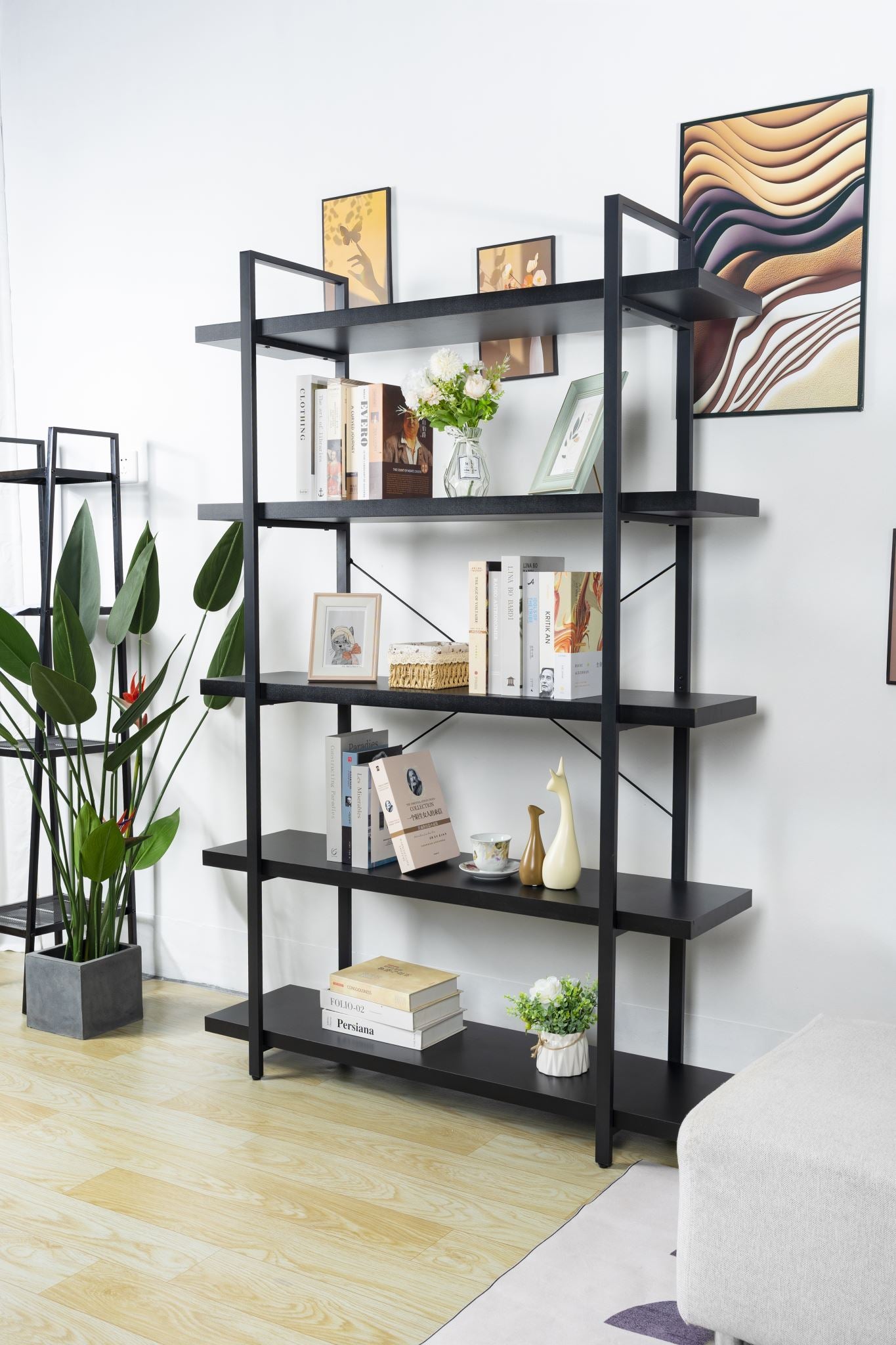 Book cabinet bookshelf holding books and photo frames in study