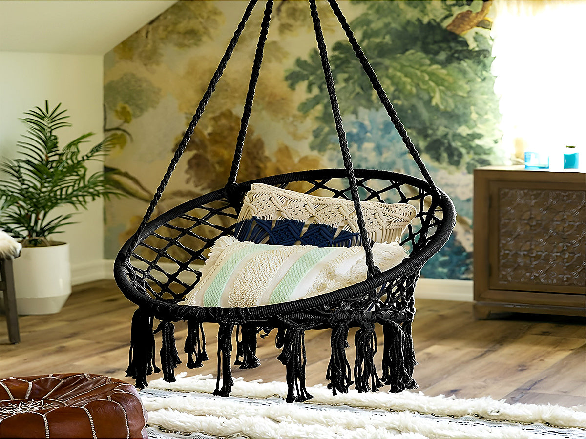 Macrame hanging chair hanging from ceiling indoors