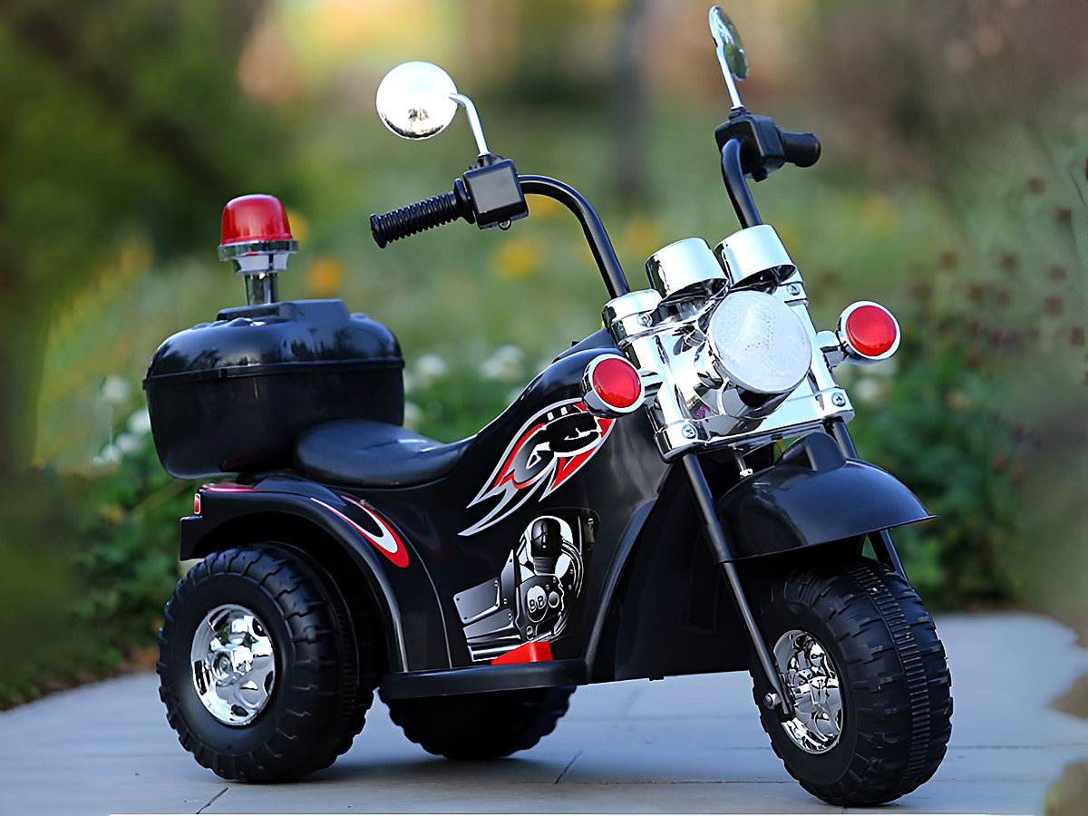Kids ride on bike showing charger and assembly guide