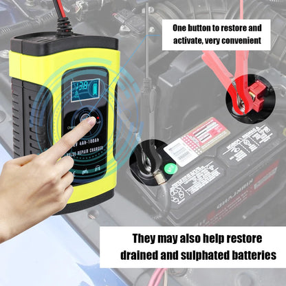 Car battery charger placed on workshop bench with tools