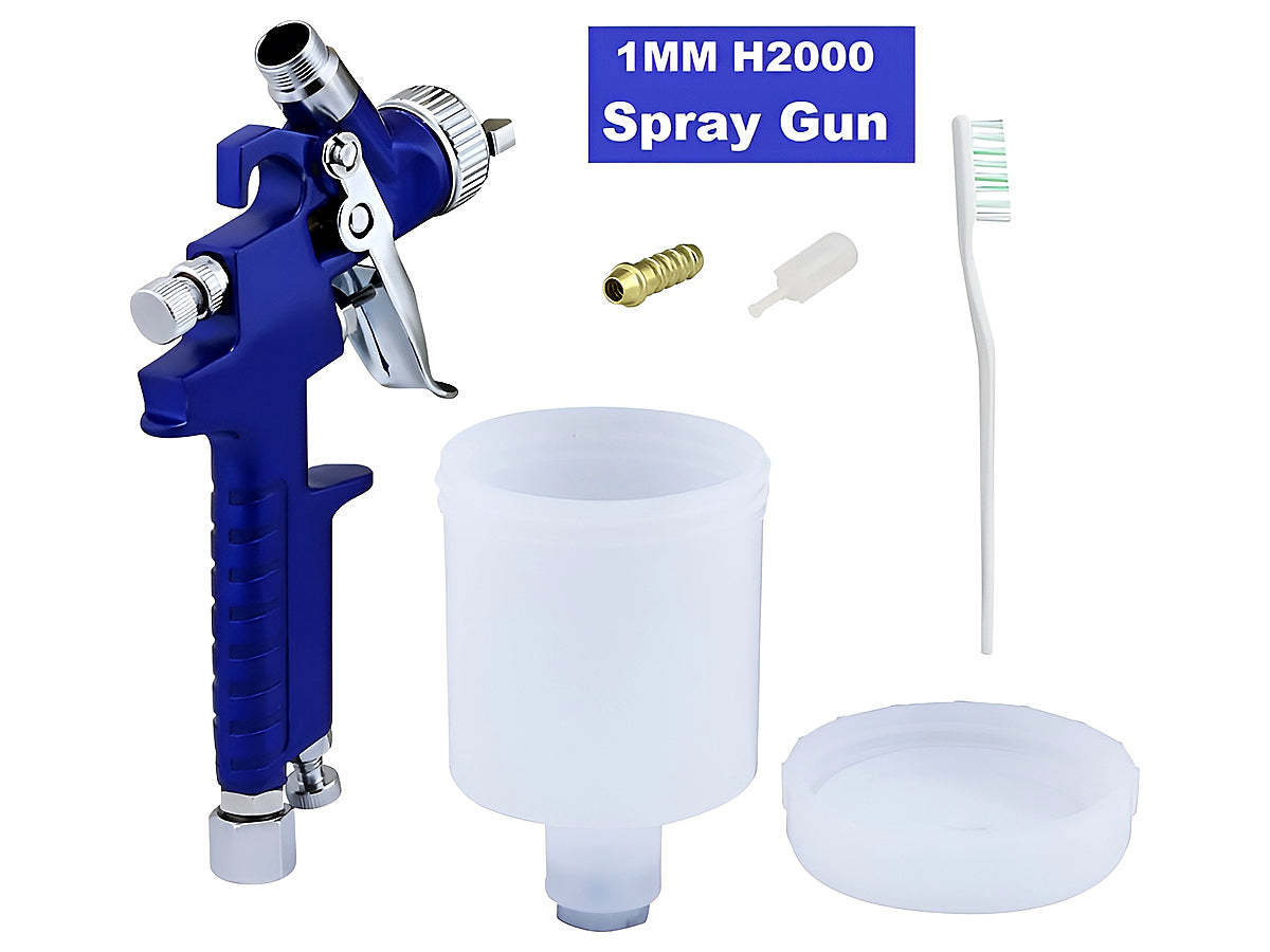 Close up of paint spray gun transparent pot with liquid level visible