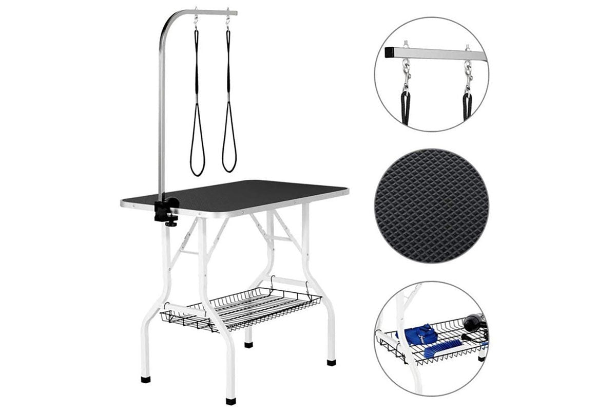 Adjustable height dog grooming table showing metal mesh frame