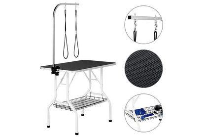 Adjustable height dog grooming table showing metal mesh frame