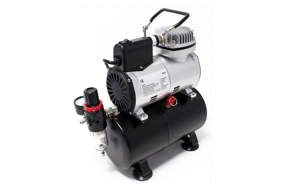 Close up of air brush compressor pressure gauge and regulator