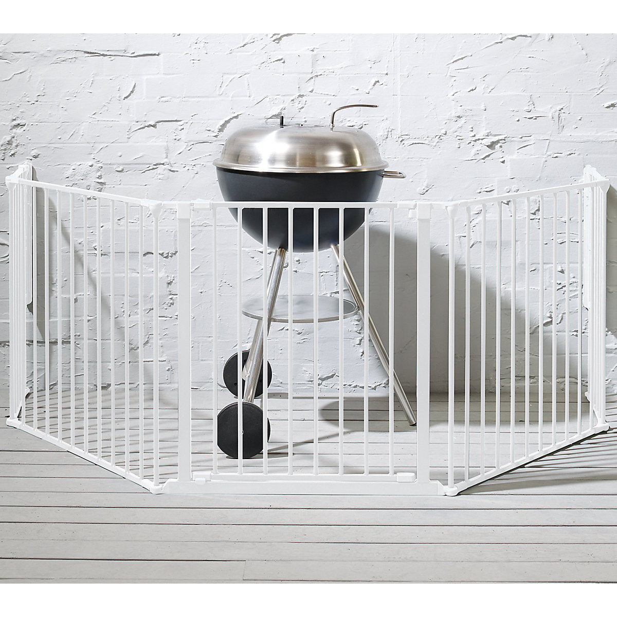 Free-standing baby safety gate fireplace barrier in living room