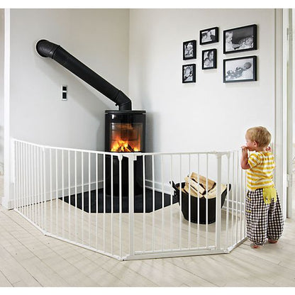 Free-standing baby safety gate fireplace barrier in living room