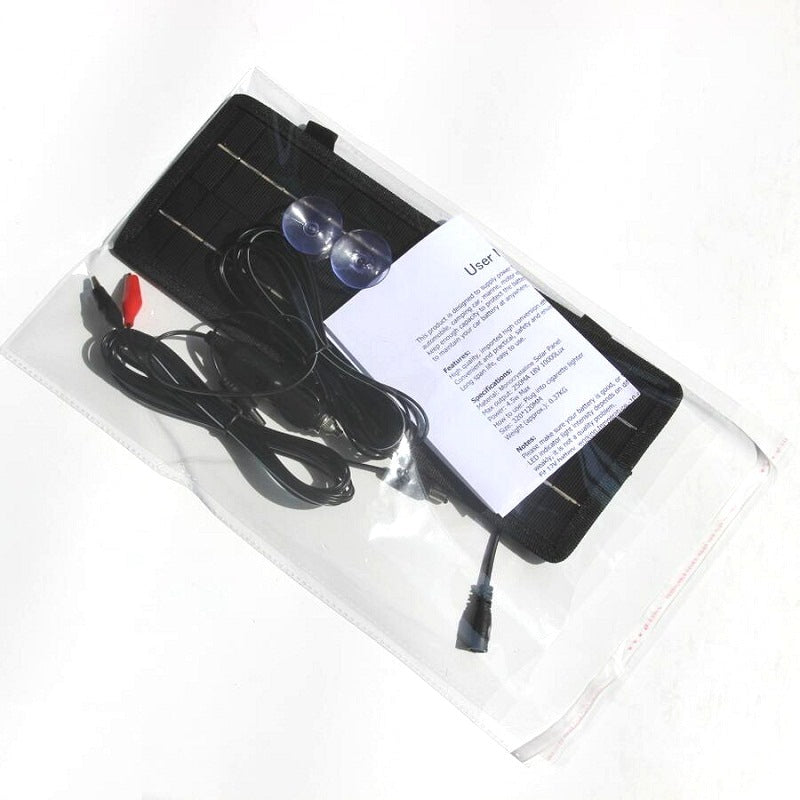 Solar car battery charger 12V in outdoor setting under sunlight
