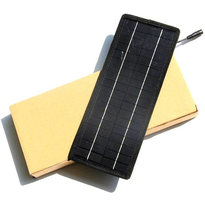 Solar car battery charger 12V connected to car cigarette lighter plug