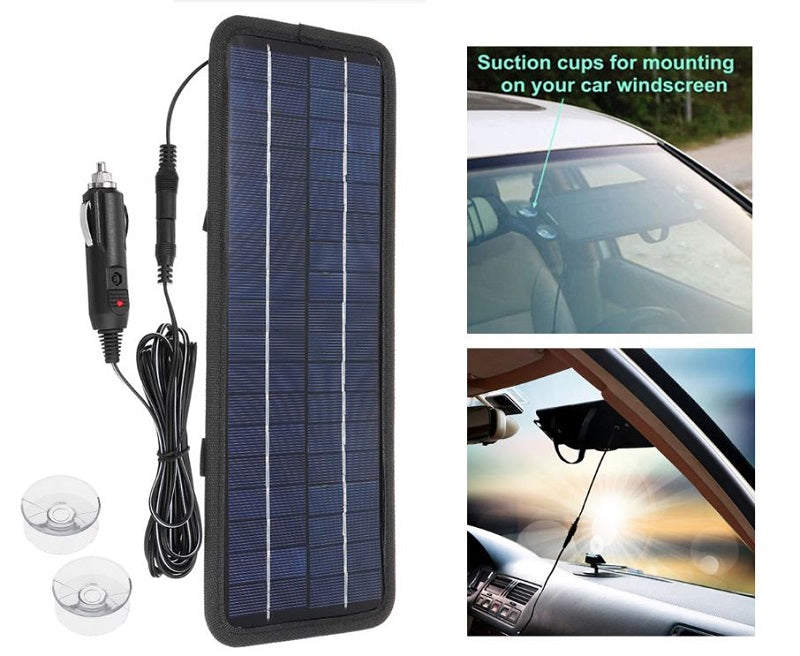 Top angle of solar car battery charger 12V with alligator clip attached