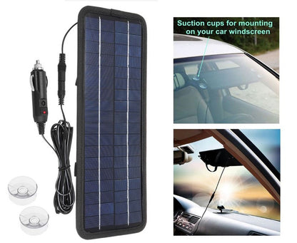 Top angle of solar car battery charger 12V with alligator clip attached