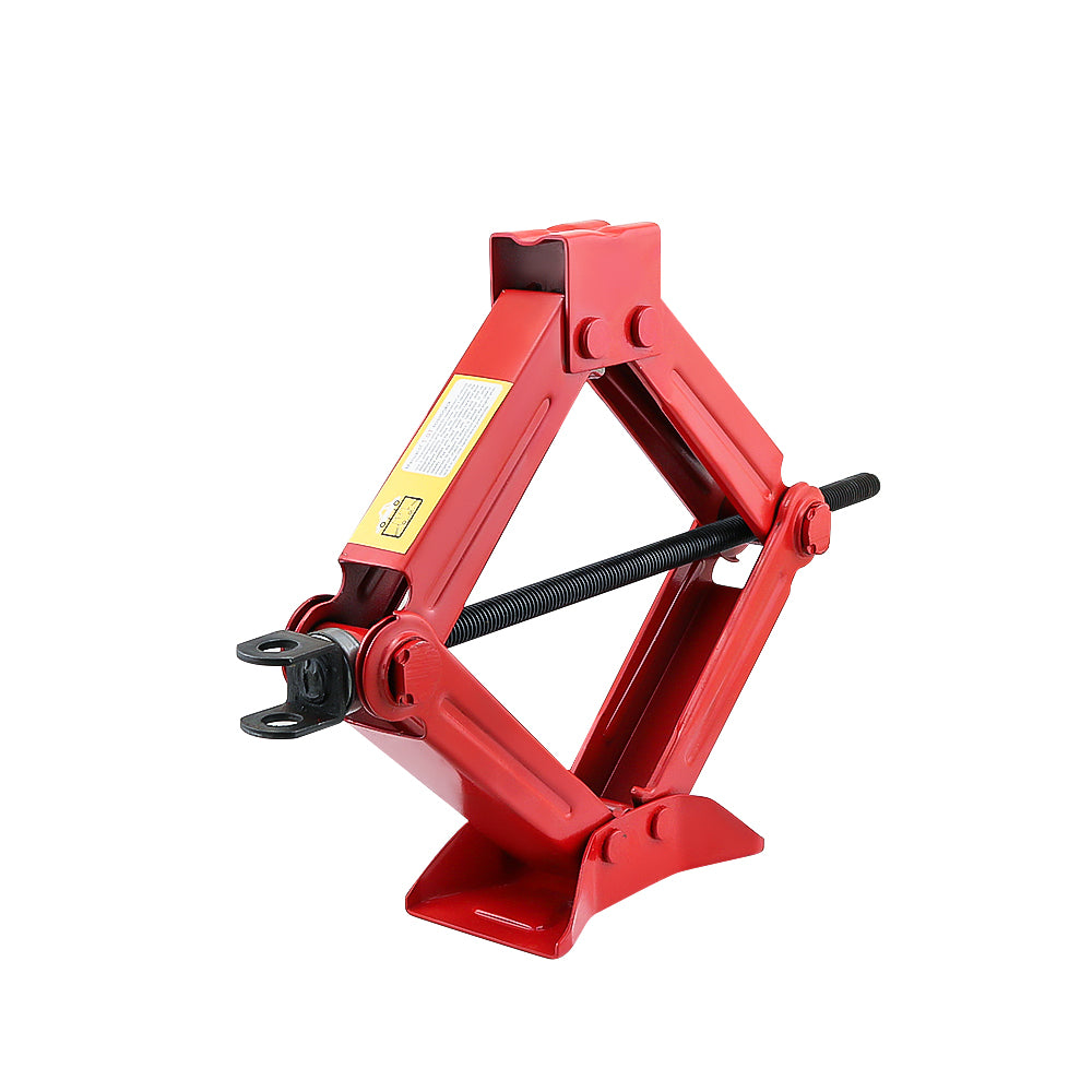 Side view of red scissors jack for car tyre changes