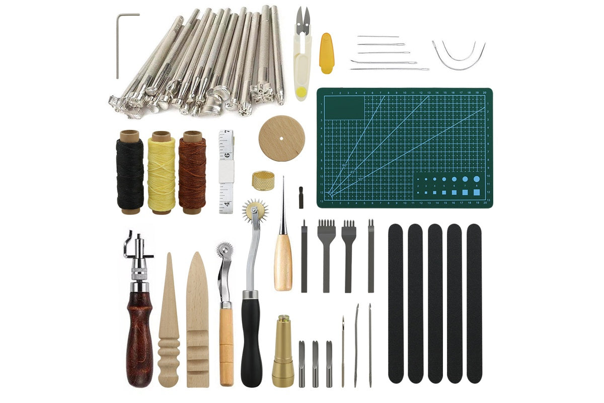 Close up of metal prong punch tools in leather craft kit