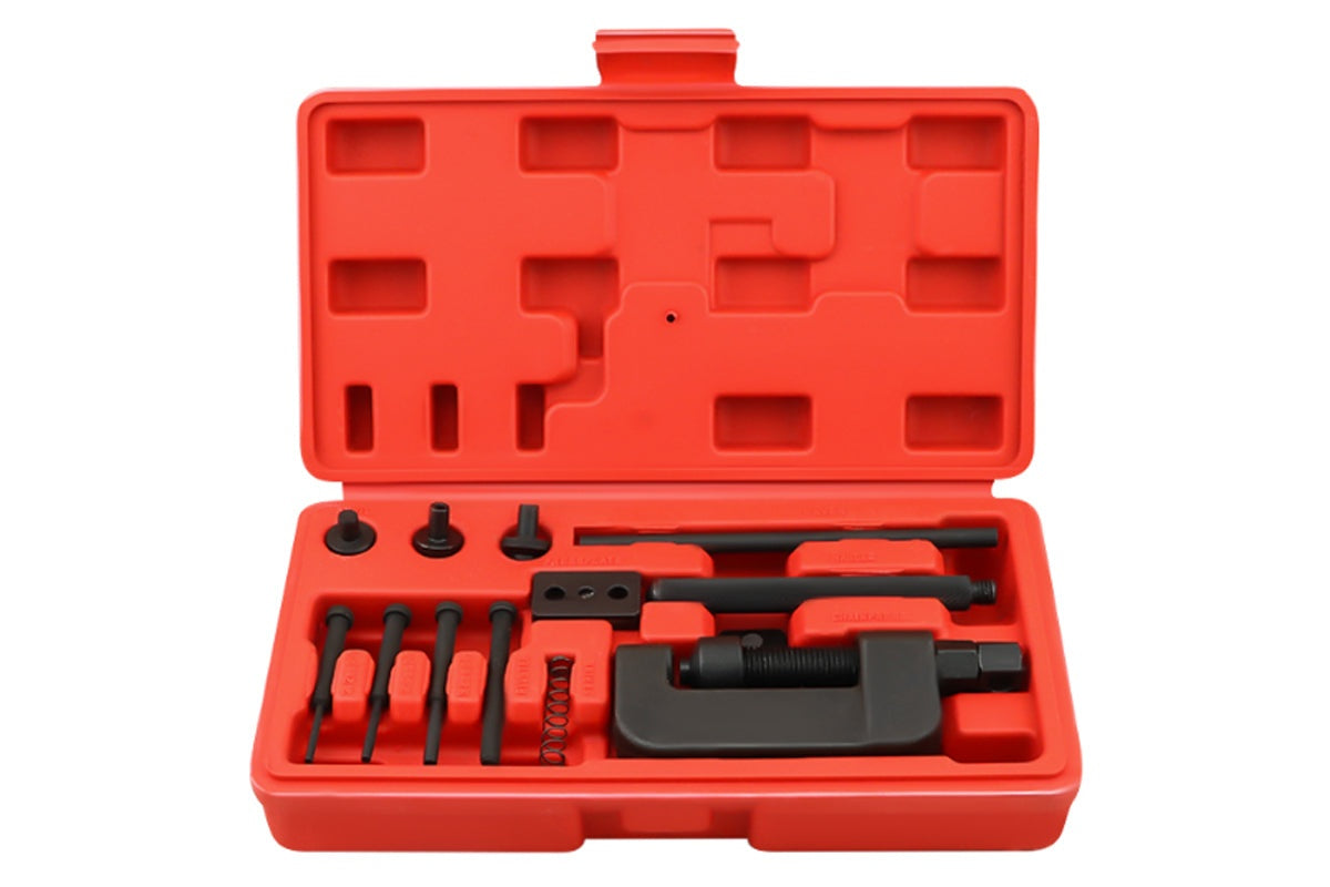 Close-up of chain breaker tool kit handle and lever in use