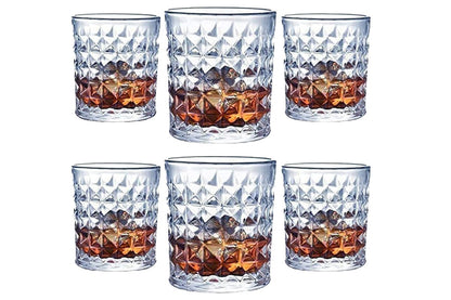 Close up of whiskey glass rim with diamond cut design
