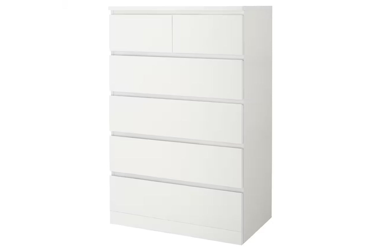 Side angle of tall boy drawers highlighting white melamine finish