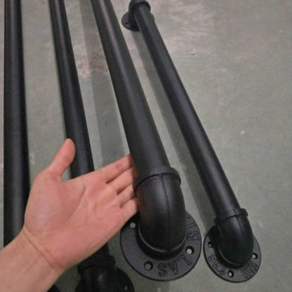 Black matte iron handrail with visible texture and finish