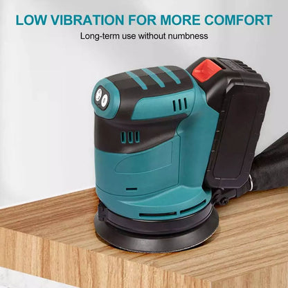 Orbital sander polishing wood surface in workshop