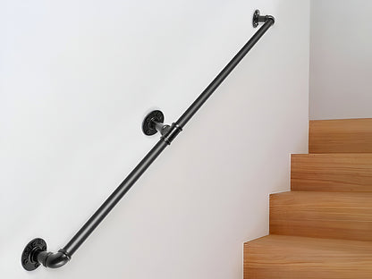 Handrail installed on wooden indoor stairs in black iron