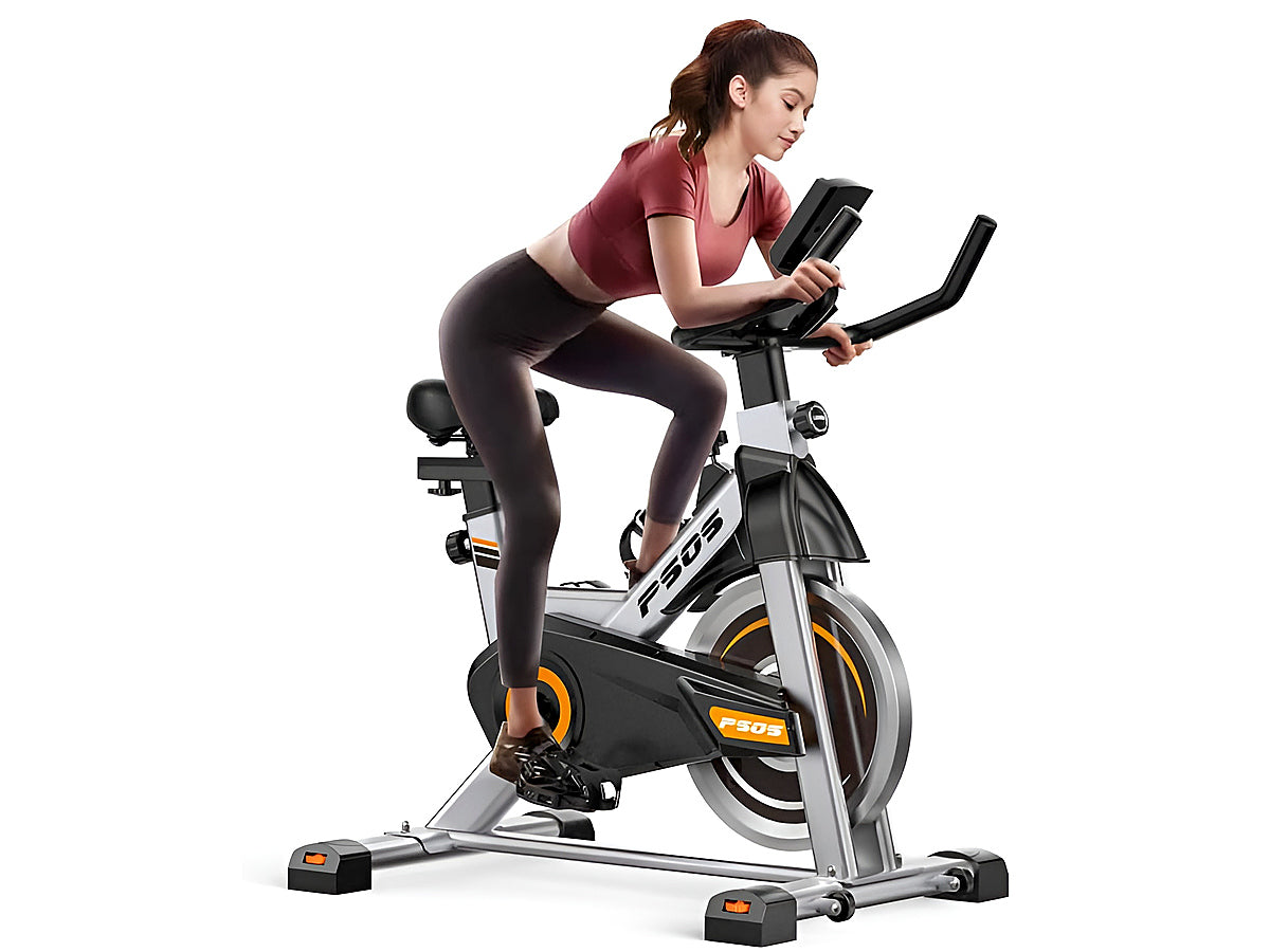 Comfortable padded seat on adjustable spin bike for home use