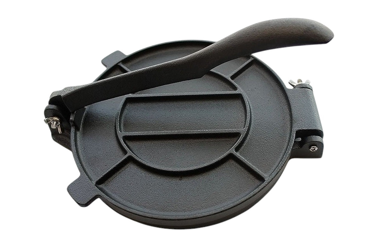Side angle of cast iron tortilla press with foldable handle