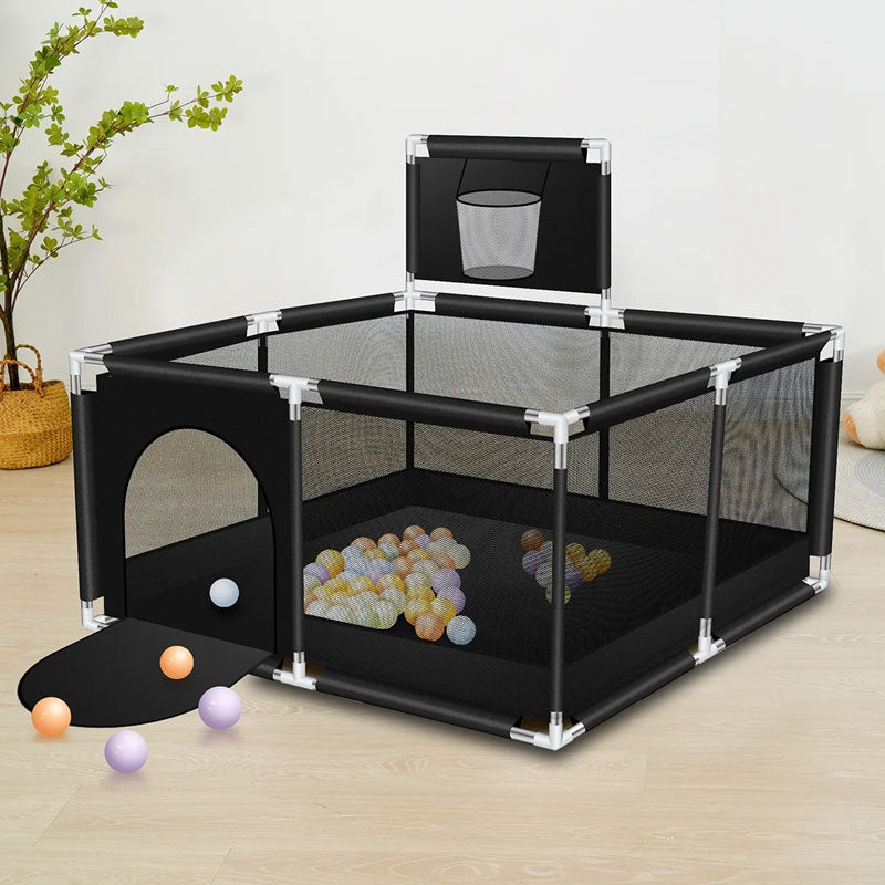 Playpen fence set up indoors on wooden floor