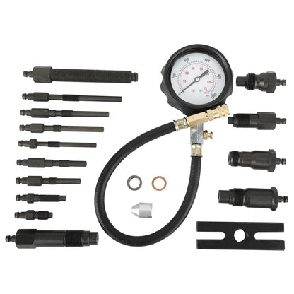 Diesel engine compression tester kit laid out showing all components