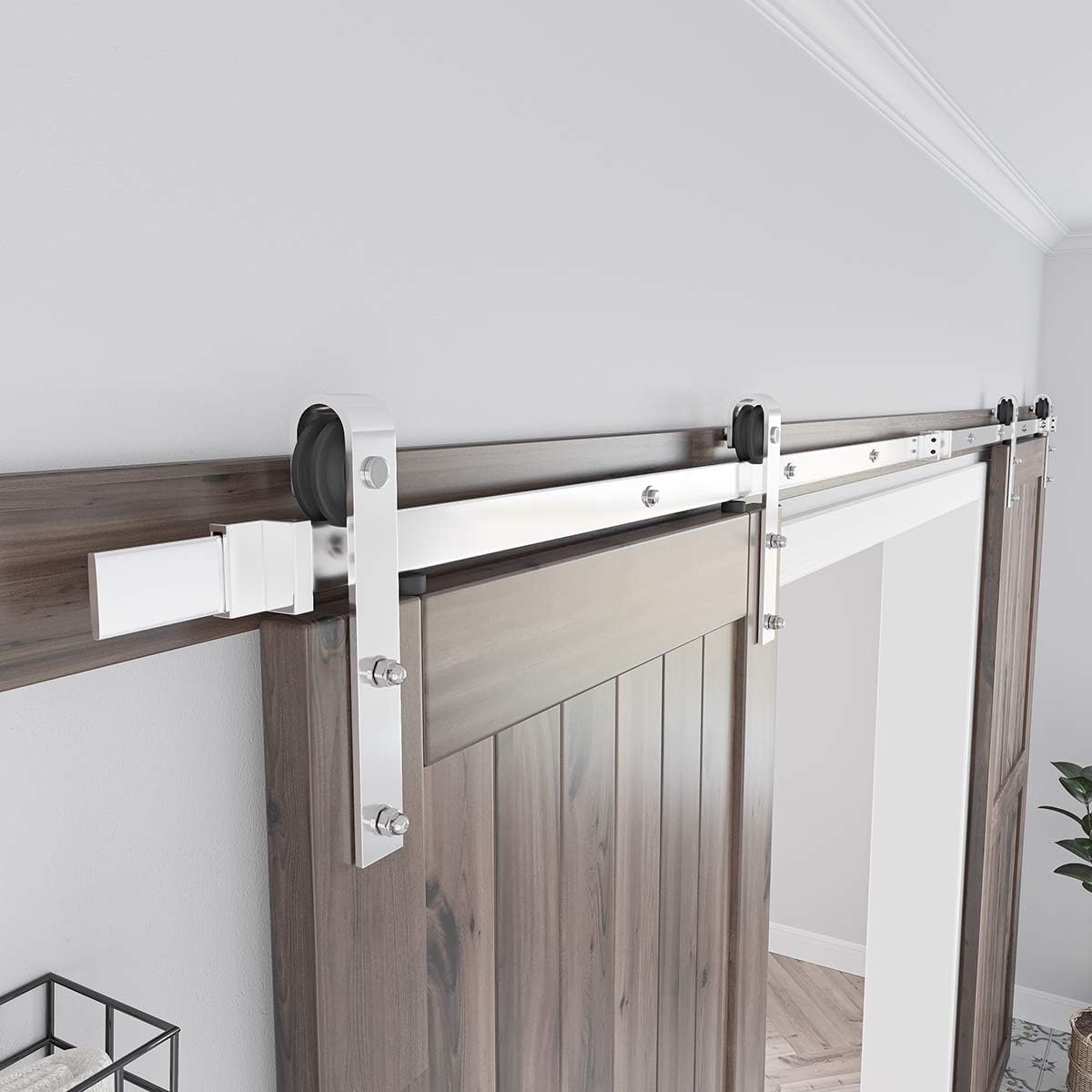 Barn door hardware door stoppers fixed at rail ends