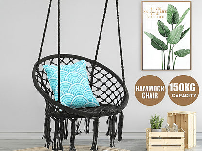 Side view of macrame hanging chair showing fringe tassels