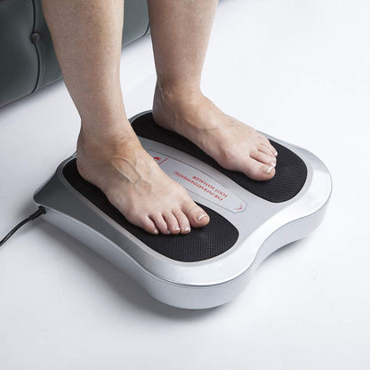 Foot massager in use with feet positioned for shiatsu massage
