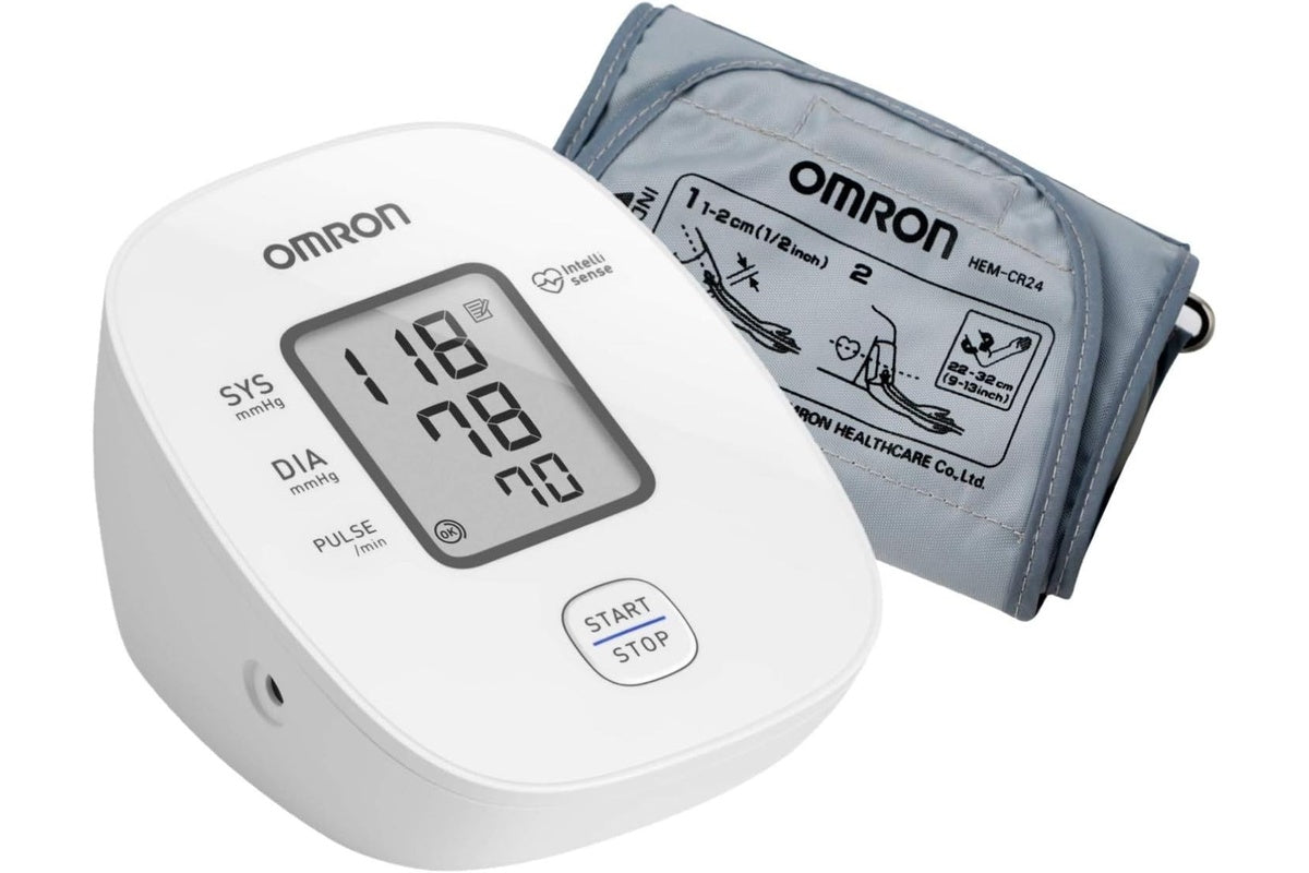 Side angle of Omron HEM7121 blood pressure monitor showing cuff attachment