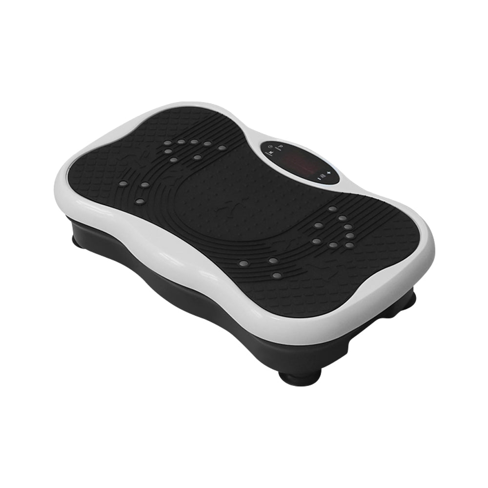 User standing on vibration plate exercise machine for leg workout