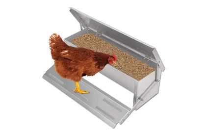 Side view of automatic chicken feeder showing treadle platform