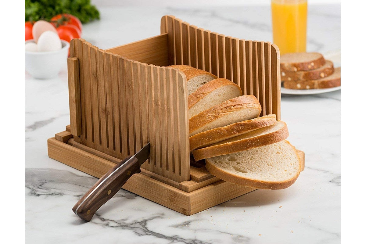 Close up of bamboo cutting board surface on bread slicer
