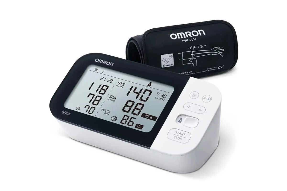 Digital display of Omron blood pressure monitor showing readings