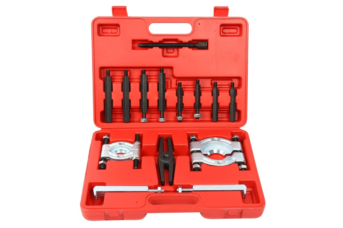 14 piece bearing puller separator kit laid out on a bench