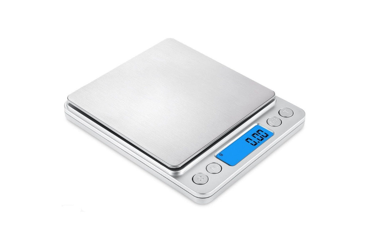 Top view of digital kitchen scale with blue backlit LCD display
