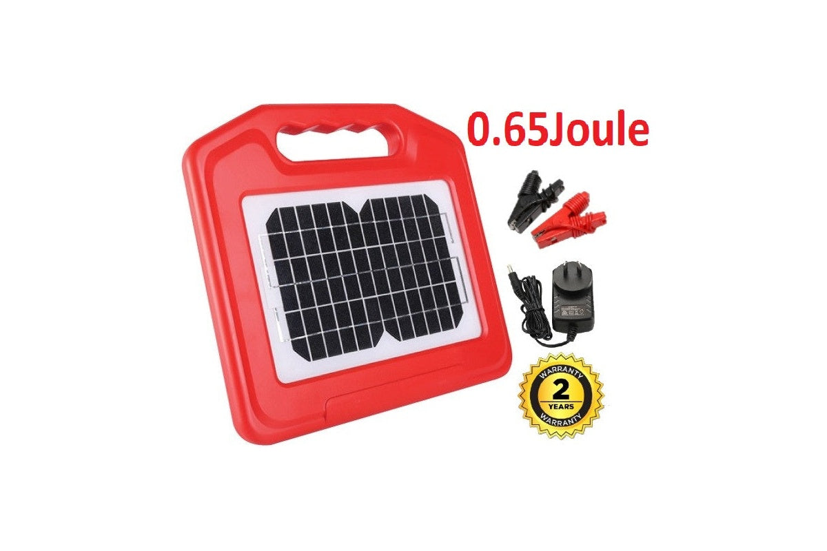 Side angle of solar electric fence energiser with charger attached