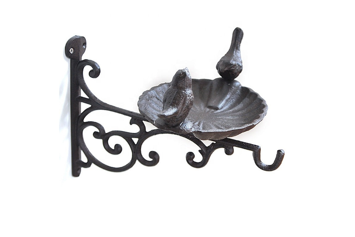 Side view of cast iron bird bath with wall mounted bracket